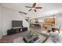 Open-concept living area with a modern kitchen, cozy dining space, and stylish furnishings at 2109 S Luther --, Mesa, AZ 85209