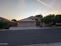 Charming single-story home featuring a three-car garage and well-maintained landscaping at 2434 S Colleen --, Mesa, AZ 85210