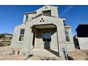 New construction home featuring a stucco exterior, porch and modern window design at 26119 N 23Rd Ave, Phoenix, AZ 85085
