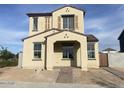 Charming two-story home with a light-colored stucco finish and a covered front porch entry at 26119 N 23Rd Ave, Phoenix, AZ 85085