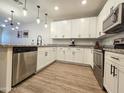 Contemporary kitchen showcasing stainless steel appliances, modern fixtures, and granite countertops at 2821 S Skyline Dr # 156, Mesa, AZ 85212
