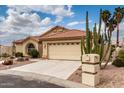 Attractive single-story home with a two-car garage, desert landscaping, and concrete driveway at 3700 N 149Th Ln, Goodyear, AZ 85395