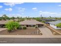 Aerial view of the home featuring a desert landscaped front yard and a covered carport at 8222 E Sheridan St, Scottsdale, AZ 85257