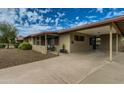 View of the covered carport featuring a gated entry and a welcoming front porch at 8222 E Sheridan St, Scottsdale, AZ 85257
