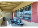Charming front porch with decorative seating, a welcome sign, and ample natural light at 8222 E Sheridan St, Scottsdale, AZ 85257