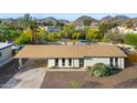 Overhead view of home with desert landscape, covered parking, and clean lines, set against a mountainous backdrop at 845 E Village Circle S Dr, Phoenix, AZ 85022