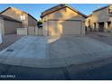 Charming home featuring a detached garage with a spacious driveway and desert landscaping at 921 S Val Vista Dr # 28, Mesa, AZ 85204