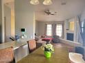 Open concept living room with hardwood floors, a fireplace, and lots of natural light at 921 S Val Vista Dr # 28, Mesa, AZ 85204