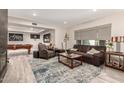 Comfortable living room with a fireplace, plush seating, and a pool table for entertaining guests at 14616 N 28Th Pl, Phoenix, AZ 85032