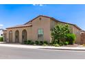 Beautiful home with red tile roof, desert landscaping, arched entrance and a two-car garage at 17279 W Dartmouth St, Surprise, AZ 85388