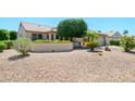 Cozy single-story home featuring mature desert landscaping, offering both beauty and minimal maintenance at 17371 N Natura Trl, Surprise, AZ 85374