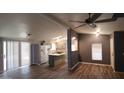 Open-concept living room leading into a bright kitchen with a butcher block island at 2400 E Baseline Ave # 144, Apache Junction, AZ 85119