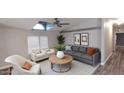 Bright living room featuring modern furnishings, vaulted ceiling, and large windows at 2400 E Baseline Ave # 144, Apache Junction, AZ 85119