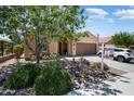 Attractive exterior of the house with a low-maintenance desert landscape and inviting entrance at 26725 W Marco Polo Rd, Buckeye, AZ 85396