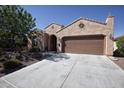Charming single-Gathering home featuring a desert landscape, inviting front entrance, and two-car garage at 26725 W Marco Polo Rd, Buckeye, AZ 85396