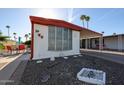 Charming mobile home featuring a covered parking area and low maintenance landscaping in a desirable community at 303 S Recker Rd # 29, Mesa, AZ 85206