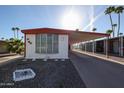 Charming mobile home featuring a covered parking area and low maintenance landscaping in a desirable community at 303 S Recker Rd # 29, Mesa, AZ 85206