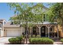Charming two-story home with a welcoming front porch, well-manicured landscaping, and a convenient two-car garage at 3109 N Black Rock Rd, Buckeye, AZ 85396