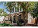 Charming two-story home with a welcoming front porch, well-manicured landscaping, and a convenient two-car garage at 3109 N Black Rock Rd, Buckeye, AZ 85396