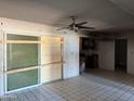 Living room showcasing a sliding glass door and fire damage at 3719 W Thunderbird Rd, Phoenix, AZ 85053