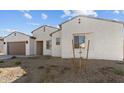 Attractive single story home showcasing stylish facade and easy care landscaping at 37627 W Padilla St, Maricopa, AZ 85138