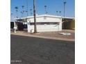 Charming single-story home with covered parking, in a well-maintained community surrounded by mature palm trees at 4065 E University Dr # 240, Mesa, AZ 85205