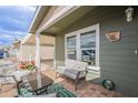 Inviting porch with comfortable seating, views of the community, and charming exterior details at 650 N Hawes Rd # 4128, Mesa, AZ 85207