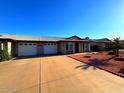 Charming single-story home featuring a two-car garage, landscaped front yard, and a welcoming entrance at 9625 W Mountain View Rd # A, Peoria, AZ 85345