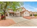 Charming two-story home with a three-car garage and a tile roof at 16215 W Durango St, Goodyear, AZ 85338