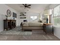 Comfortable main bedroom with ceiling fan, and a large window that allows lots of natural light at 16215 W Durango St, Goodyear, AZ 85338