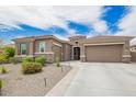 Stunning home featuring a 3-car garage, neutral color palette, and well-manicured landscaping at 44036 N Hudson Trl, New River, AZ 85087