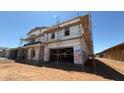 Image of a home's exterior, currently under construction, showcasing the garage and scaffolding at 11423 E Utah Ave, Mesa, AZ 85212