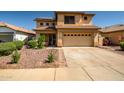 Charming two-story home featuring a well-maintained front yard, spacious driveway, and inviting curb appeal at 14246 W Columbus Ave, Goodyear, AZ 85395