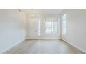 Bright and open living room with modern finishes and large windows at 1584 E Harrison E St, Chandler, AZ 85225