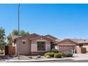 Charming single-story home with well-maintained landscaping and a welcoming entrance at 16753 W Bristol Ln, Surprise, AZ 85374