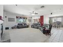 Spacious living room with fireplace and comfortable seating at 16753 W Bristol Ln, Surprise, AZ 85374