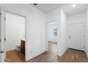 Hallway with white walls, and a half-bathroom with tile floors is visible at 238 W Kona Dr, Casa Grande, AZ 85122