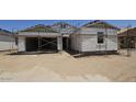 New construction home featuring attached two-car garage and unfinished landscaping at 32123 N Lone Rancher Way, San Tan Valley, AZ 85140