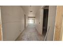 Spacious hallway with natural light, smooth concrete floor, and drywall walls at 32123 N Lone Rancher Way, San Tan Valley, AZ 85140