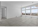 Well-lit room featuring large windows, perfect for a living or office space at 32497 N 135Th Dr, Peoria, AZ 85383