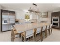 Modern kitchen with a large island, stainless steel appliances, and custom lighting at 523 W Vista Ave, Phoenix, AZ 85021
