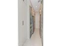 Large pantry space with sleek, modern cabinetry, wine storage, and stainless steel refrigerator at 523 W Vista Ave, Phoenix, AZ 85021