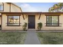 Inviting home entrance with decorative window boxes and a secure front door at 6021 N 31St Ave, Phoenix, AZ 85017