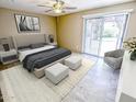 Bright bedroom with a large bed, stylish furniture, and a sliding glass door to the outdoor space at 6721 E Phelps Rd, Scottsdale, AZ 85254