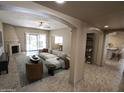 A spacious living room featuring a fireplace, open floor plan, and stylish modern decor at 6721 E Phelps Rd, Scottsdale, AZ 85254
