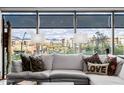Living room featuring a view of the city from the large windows at 7180 E Kierland Blvd # 316, Scottsdale, AZ 85254
