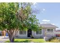 Exterior view of home, featuring steel window and door protection bars for enhanced security at 7235 W Flower St, Phoenix, AZ 85033
