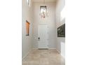 Bright foyer features soaring ceilings, tile floors, and elegant lighting at 9270 E Thompson Peak Pkwy # 367, Scottsdale, AZ 85255