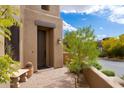 Exterior view of the front door and desert landscaping at 9270 E Thompson Peak Pkwy # 367, Scottsdale, AZ 85255