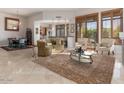 Open-concept living room showcases tile floors and elegant furniture at 9270 E Thompson Peak Pkwy # 367, Scottsdale, AZ 85255